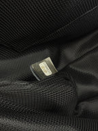 Textile care label inside dark lining of Chanel bag.