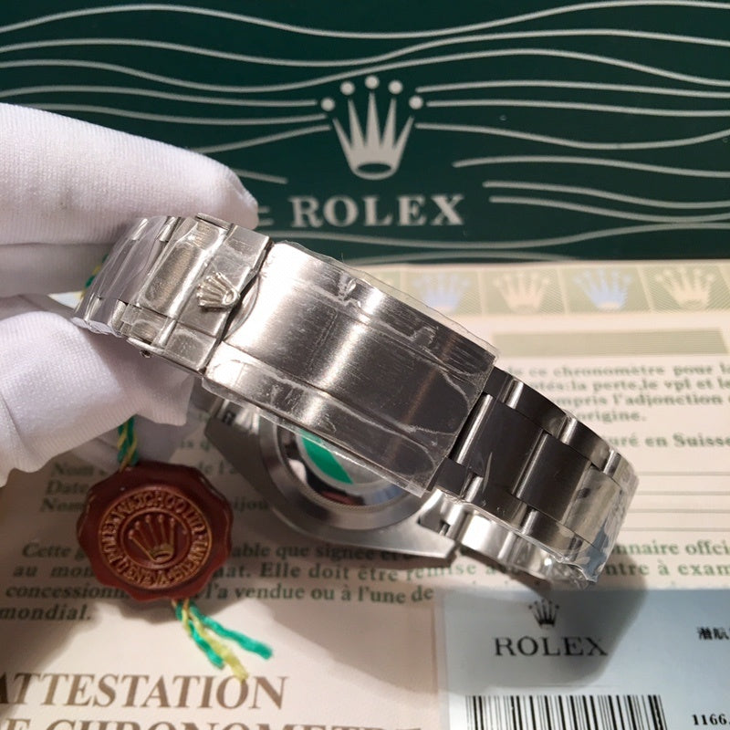 Rolex stainless steel watch side with bracelet clasp; green bezel and black dial