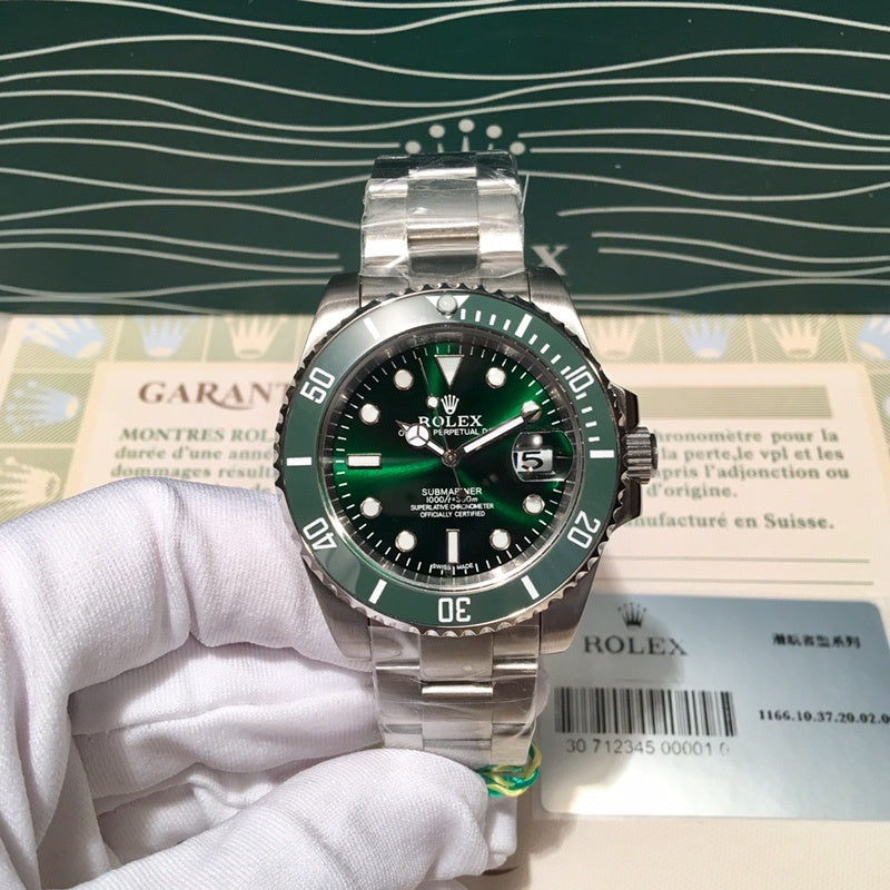 Rolex Submariner-style stainless steel watch with green bezel and black dial