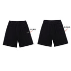 Black shorts front and back view with color label arrows
