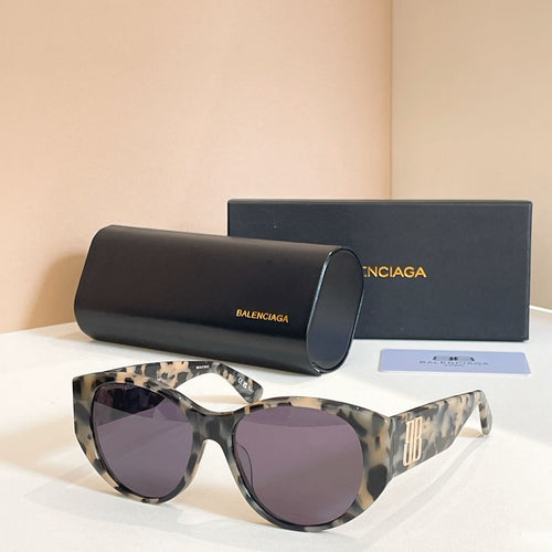 Tortoiseshell sunglasses with dark lenses, with black case