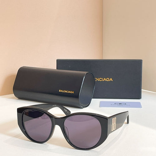 Black sunglasses with purple lenses, with black case