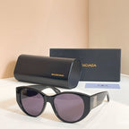 Dark gray sunglasses with purple lenses, with black case