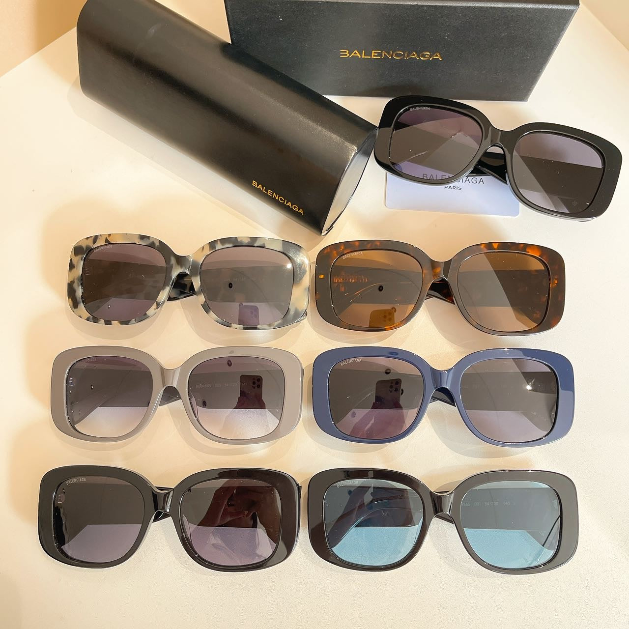 Assorted sunglasses with different frame colors and tinted lenses, shown in rows