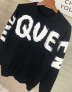 Alexander McQueen knit sweater in black with large white QVE lettering