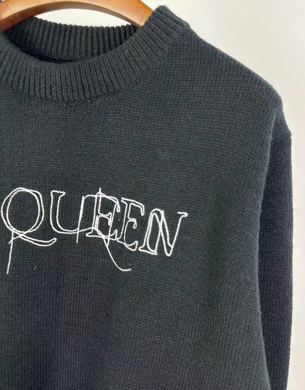 Dark knit sweater with crew neck and McQUEEN logo print on chest