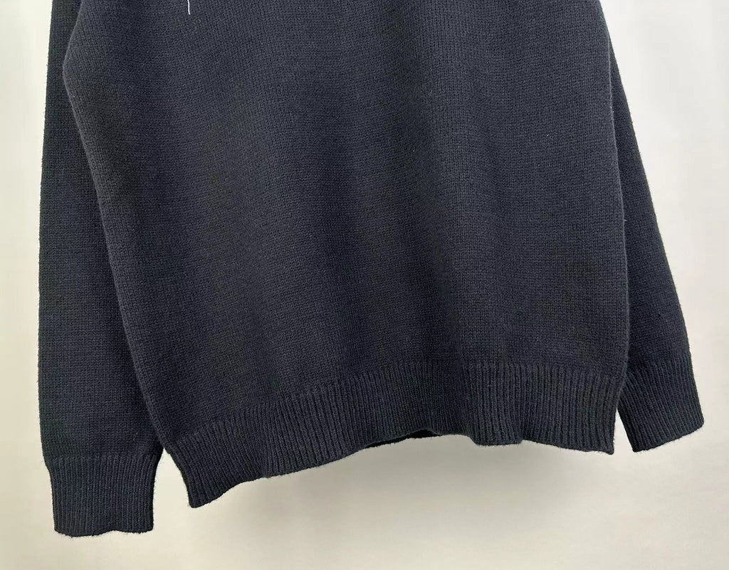 Dark knit sweater back with ribbed cuffs and hem, solid knit fabric