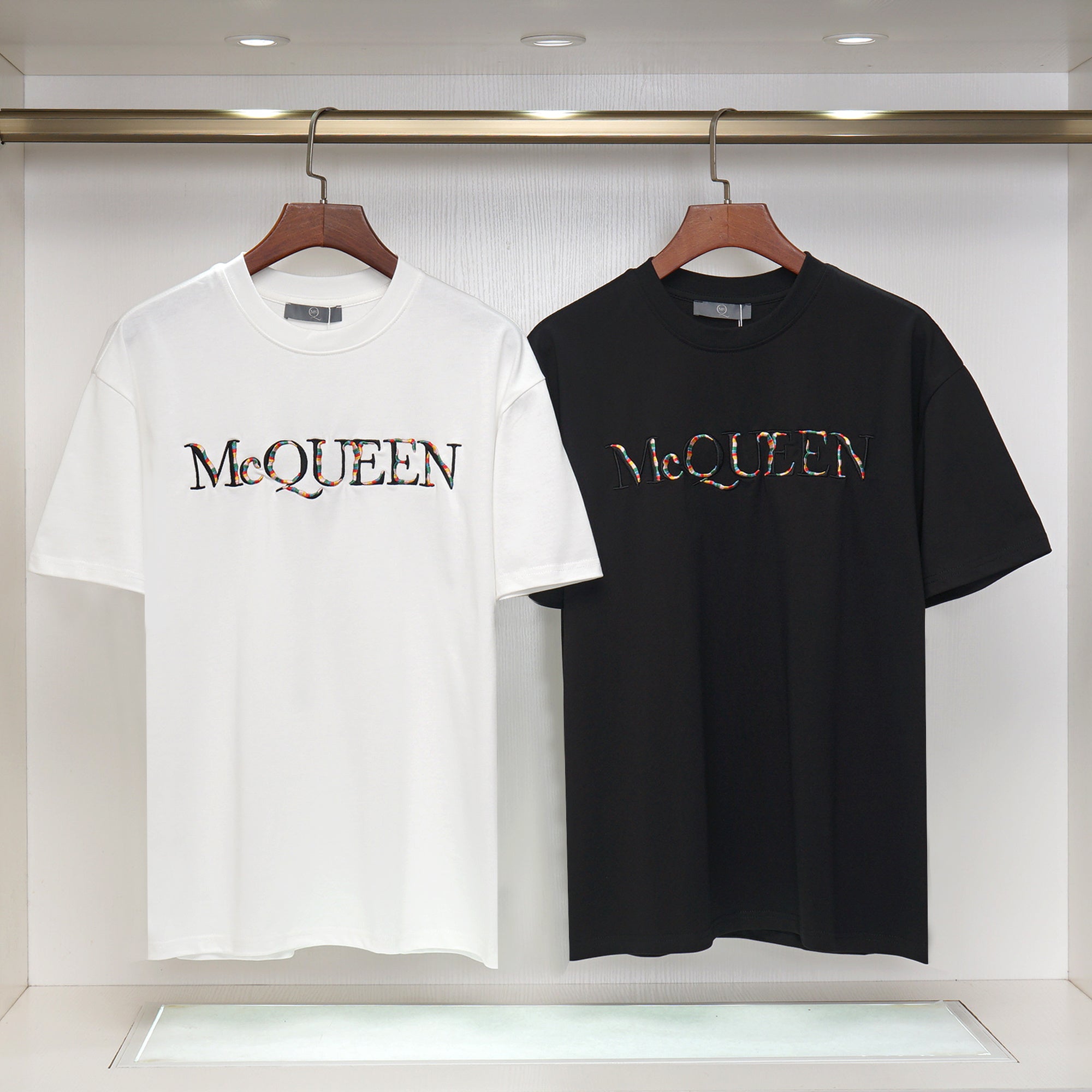 Pair of Alexander McQueen T-shirts, white and black crewneck