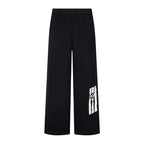 Black wide-leg pants with side logo patch and elastic waistband