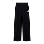 Dark wide-leg trousers with pleated front and elastic waistband