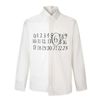 White button-up shirt with black number print across the front; long sleeves