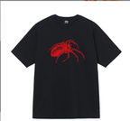 Stussy black T-shirt with red spider graphic on chest