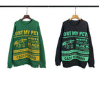 Green crewneck sweatshirt with “LOST MY PET” graphic and “CASH REWARD” text at hem