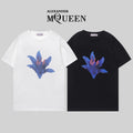 Alexander McQueen cotton T-shirts, white and black, blue flower graphic front