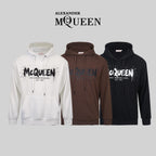 Alexander McQueen pullover hoodies in white, brown, and black; drawstring hood.