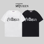 Crewneck T-shirts in white and black with distressed McQUEEN graphic