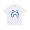White crewneck T-shirt with blue camouflage graphic and gold stripe