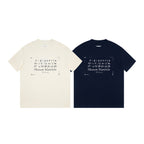 Two Maison Margiela T-shirts: cream and navy, each with number and Paris print