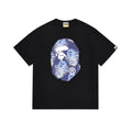 Bape black T-shirt with oval character graphic on the chest