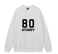 Light gray crewneck sweatshirt with '80 STUSSY' front graphic