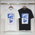 Alexander McQueen T-shirt pair: white and black, blue skull graphic on front