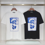 Alexander McQueen T-shirt pair: white and black, blue skull graphic on front