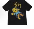 Black graphic T-shirt with blue and yellow cartoon character print and graffiti-style text