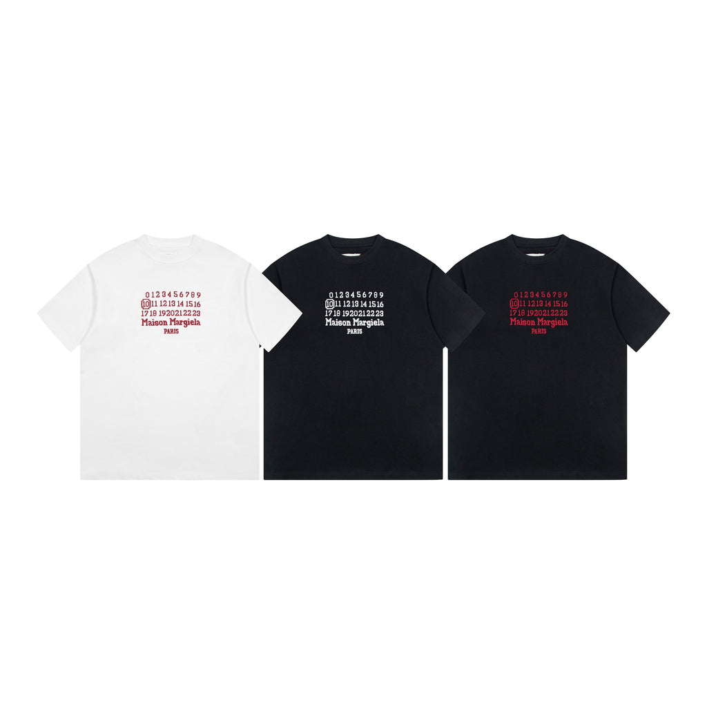 Three short-sleeve graphic T-shirts: white, charcoal, and black