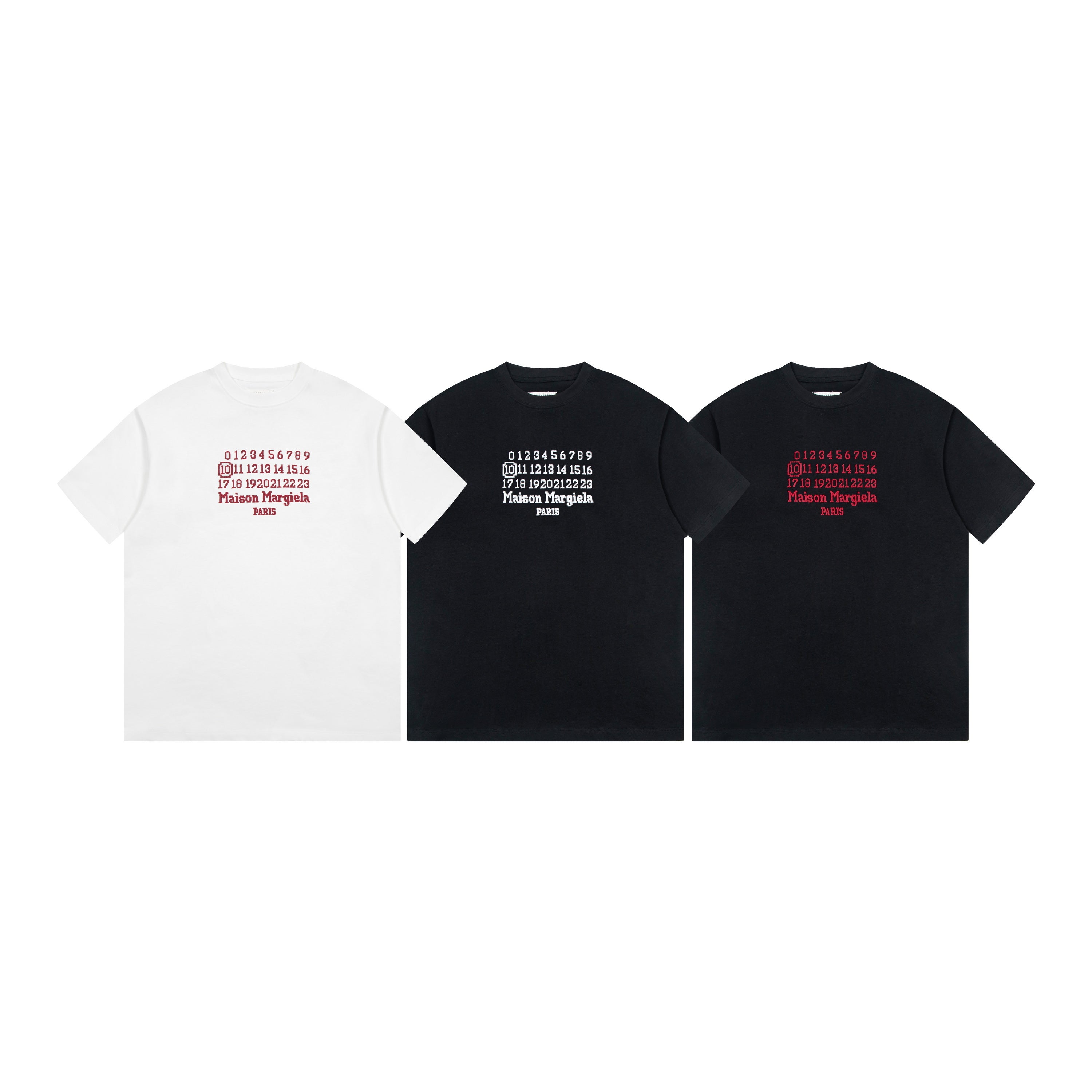 Three short-sleeve graphic T-shirts: white, charcoal, and black