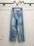 Light blue distressed denim wide-leg jeans with ripped knee details