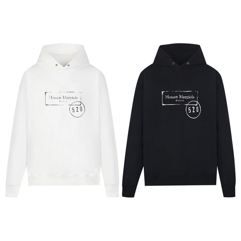 Maison Margiela hoodies, white and black, each with hood and front kangaroo pocket.