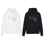 Maison Margiela hoodies, white and black, each with hood and front kangaroo pocket.
