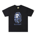 Black Bape T-shirt with camo ape face graphic and BY BATHING APE text