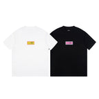 Pair of crewneck T-shirts, white and black, with multicolor chest labels