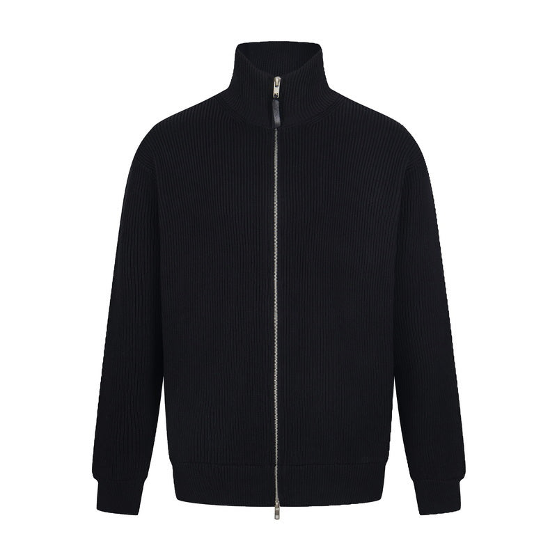 Black zip-front knit jacket with stand collar and ribbed texture