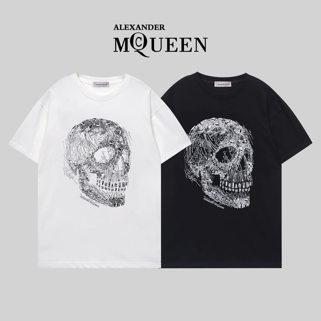 Alexander McQueen T-shirt pair: white and black crewneck with silver skull graphic