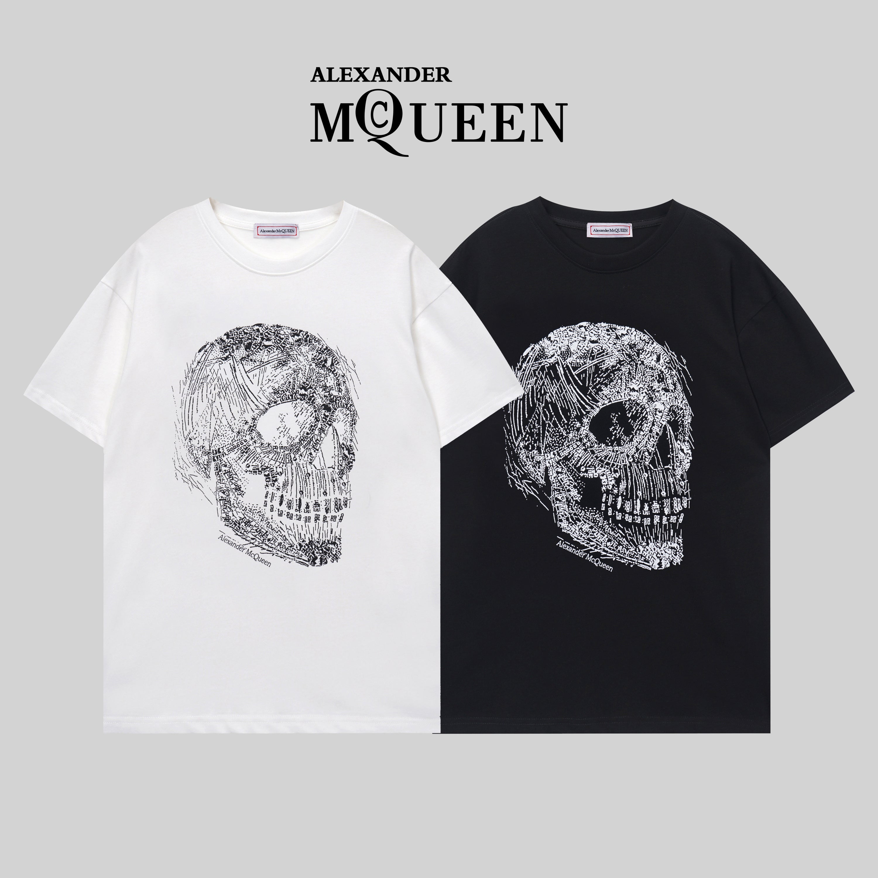 Alexander McQueen T-shirt pair: white and black crewneck with silver skull graphic