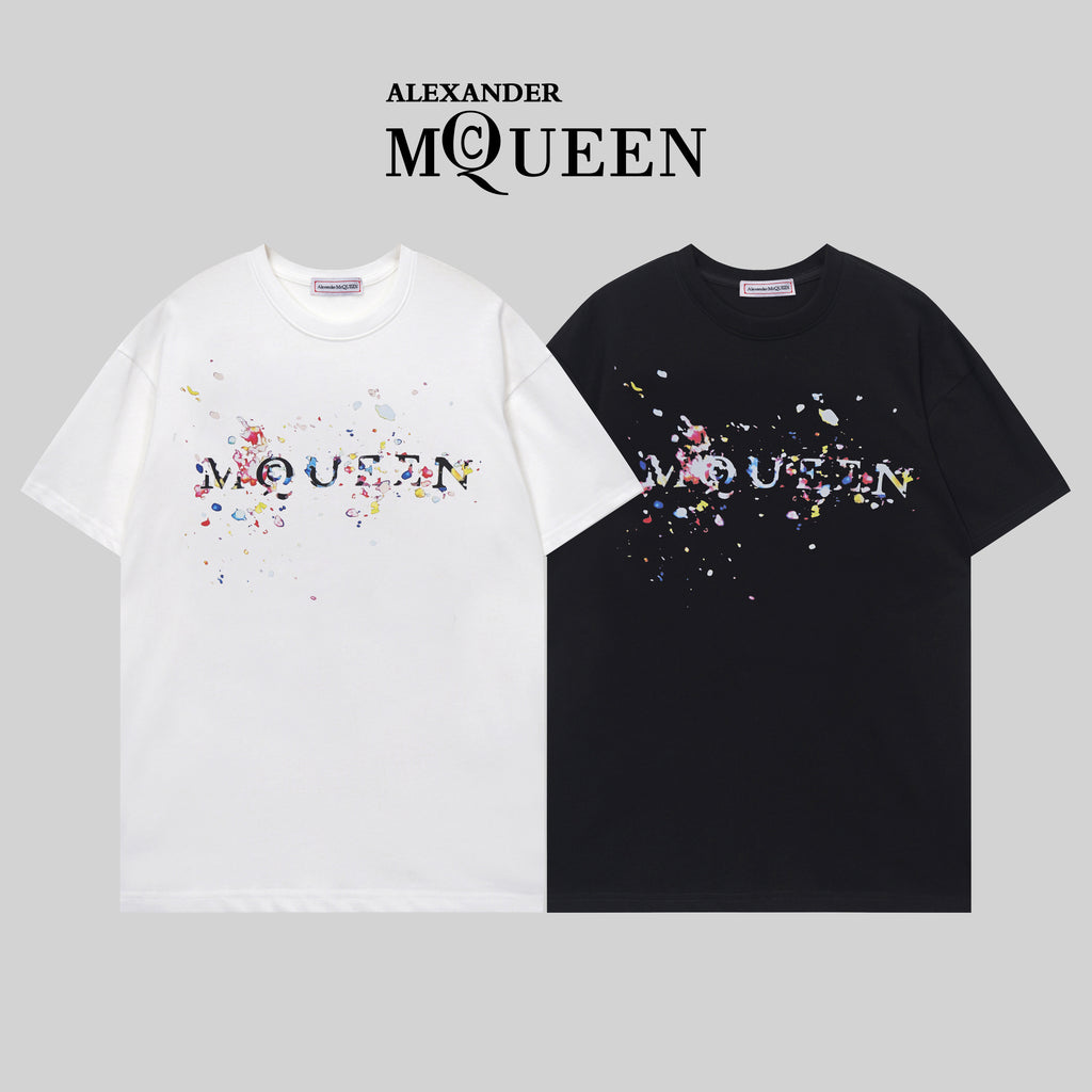 Two Alexander McQueen T-shirts in white and black with colorful splatter logo graphic