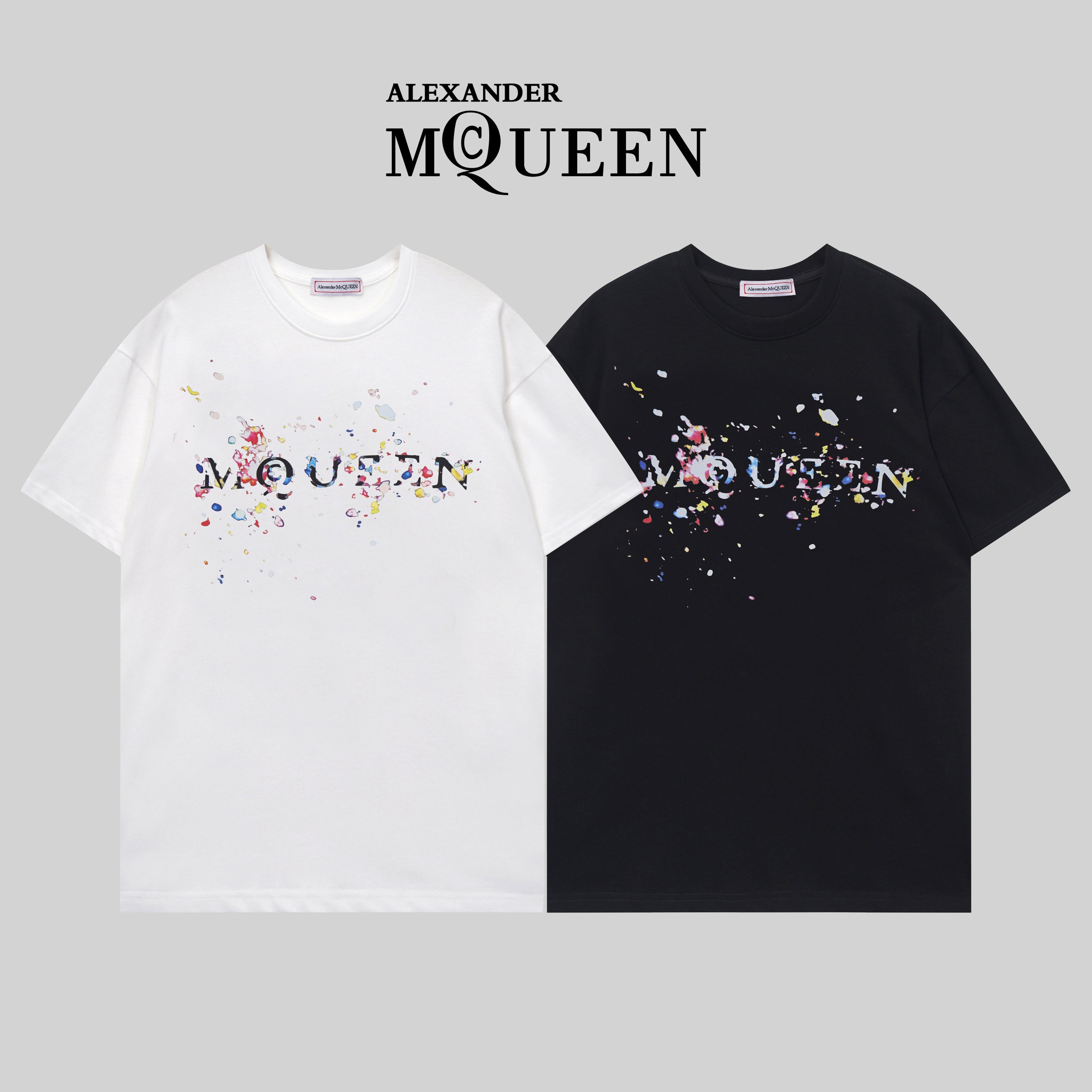Two Alexander McQueen T-shirts in white and black with colorful splatter logo graphic
