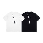 Pair of Maison Margiela T-shirts, one white and one black, with abstract graphic
