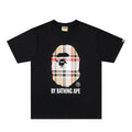 Black Bape T-shirt with front portrait graphic and BY BATHING APE text