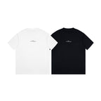 Pair of Maison Margiela crew-neck T-shirts: white and black, short sleeves.