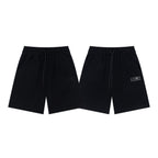 Black drawstring shorts with front and back views