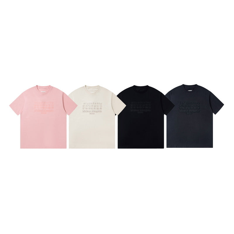 Set of four short-sleeve T-shirts in pink, cream, black, and dark navy