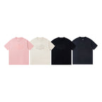 Set of four short-sleeve T-shirts in pink, cream, black, and dark navy