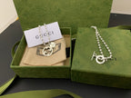 Silver chain necklace with round GUCCI logo pendant and small dangling charm