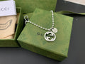 Silver chain necklace with round GUCCI logo pendant and heart tag