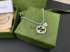 Silver chain necklace with round GUCCI logo pendant and heart tag