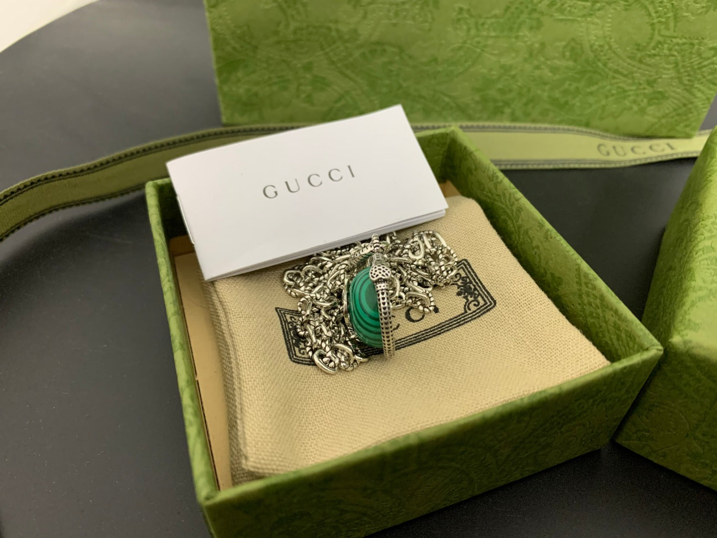 Gucci green-center medallion pendant with ornate silver filigree in box