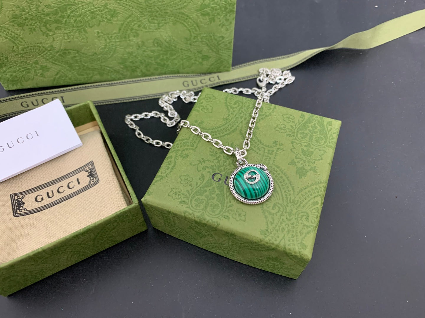 Gucci pendant necklace with green medallion on silver chain